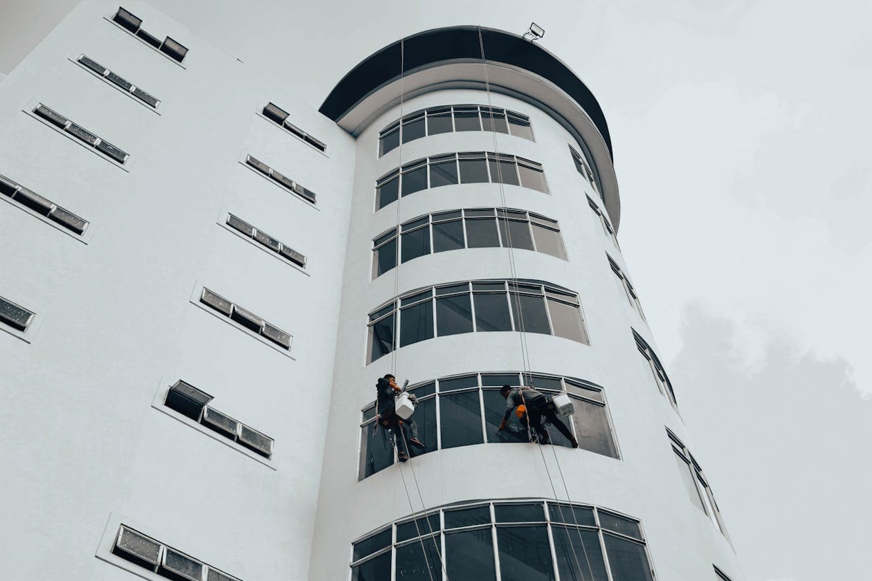Commercial Facade — Worker at Height
